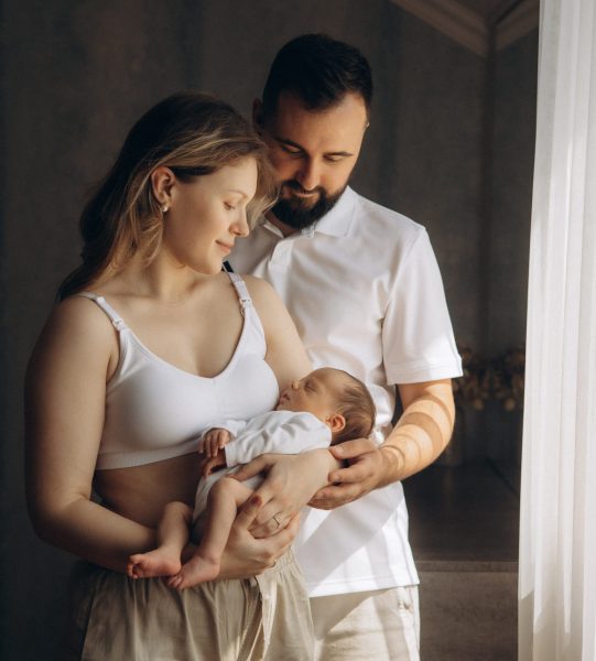 man-holding-baby-woman-holding-baby