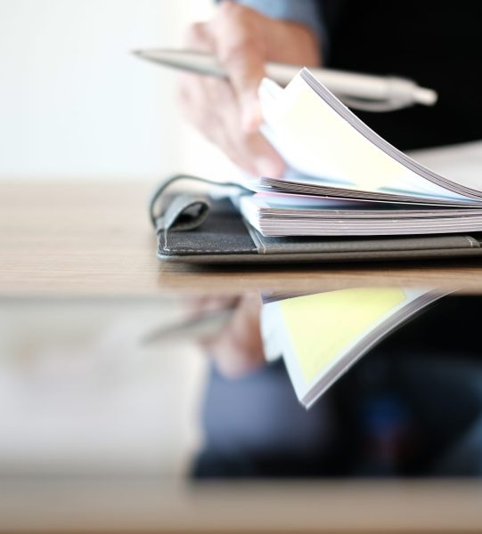 businessman working organizing plan with notebook at workplace coworking office