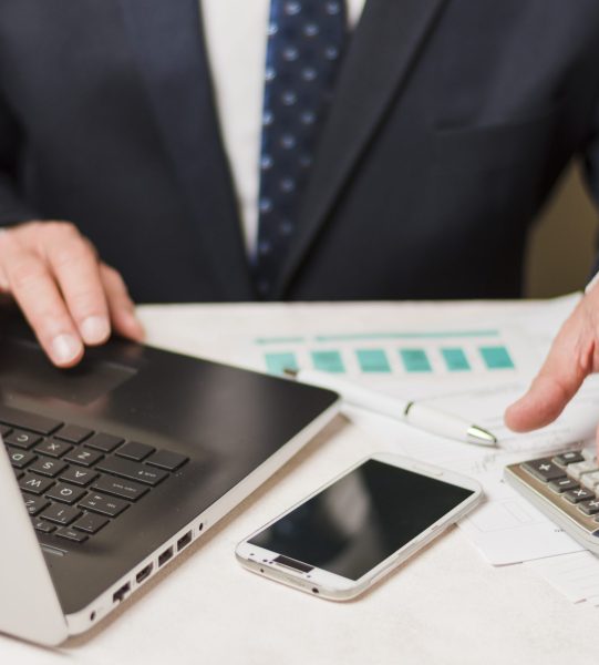 businessman-using-calculator